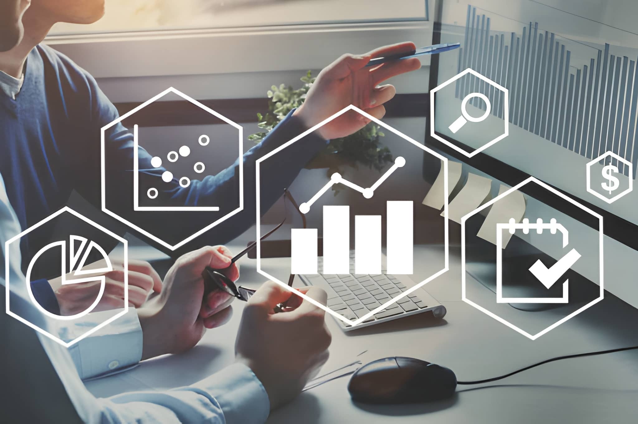Hands reviewing analytics charts on a desk